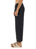 Studio Nicholson Pantalone en mezclilla