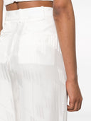 Los pantalones del logotipo de Attico