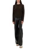 Suéter de lana de ganso dorado con detalle de botones