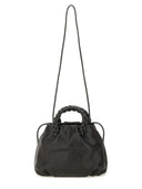Her "Bombon smidig skinnende" medium taske
