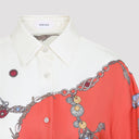Abito Versace in twill di seta con gioielli rubati