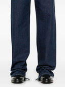 Jeans di cotone in denim gamba larga Gucci