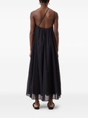 片方の肩のコットンドレスを閉じた