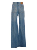 Jeans di cotone a gamba svasata di Saint Laurent