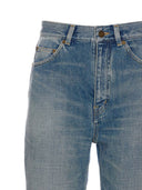 Jeans di cotone a gamba svasata di Saint Laurent