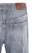 Jeans di cotone in denim Brunello Cucinelli