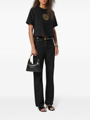 Versace Sac hobo en cuir avec étiquette Versace