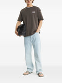 T-shirt in cotone con scritta Maison Kitsune
