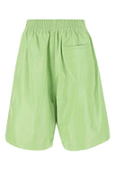 Pantaloncini in pelle verde pastello di Bottega Veneta