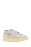 Tela grigia jil sander e sneaker di cesto in gomma