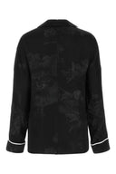 Fuori dalla camicia satinata ricamata bianca