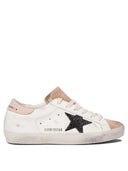 Sneakers Golden Goose et glissade