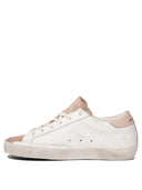 Sneakers Golden Goose et glissade