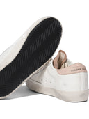 Sneakers Golden Goose et glissade