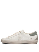 Sneakers Golden Goose et glissade