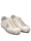 Sneakers Golden Goose et glissade
