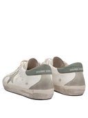 Sneakers Golden Goose et glissade