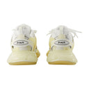 Volg heldere enige sneakers in witte crème