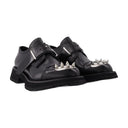 Mocasines con pernos en cuero negro