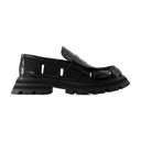 Bottes de cheville errant Alexander McQueen en cuir noir / blanc