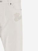 Off jeans in denim di cotone bianco con logo