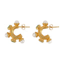 Le voyageur 's Boucles d'oreilles de chemin en or