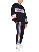 GCDS Jogging Pants z „uroczą taśmą” opaską logo