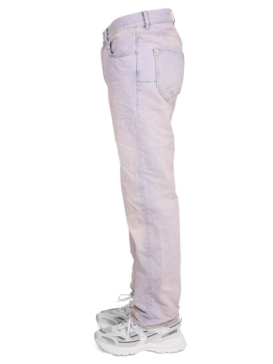 Jeans di marca viola in denim