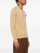 Comme des Garçons gioca a maglia emblema nera rotonda