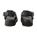 Sandalias de hebilla de acné estudios de cuero negro