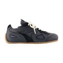 Långsam löpare sneakers axel arigato läder svart
