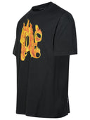 تي شيرت من القطن باللون الأسود مطبوع عليه عبارة "Burning Monogram" من Palm Angels