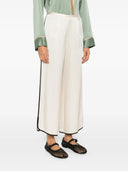 Pantalon court brillant fort vers le satin