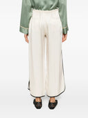 Pantalon court brillant fort vers le satin