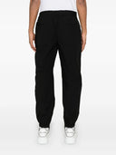 Dolce & Gabbana Tapered Trousers With Logo Plaque