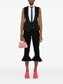 Gilet de moschino avec un large décolleté