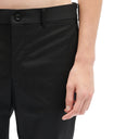 Comme des garcons pantalones delgados