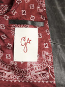 Chaqueta de motociclista de cuero angustiada dorada