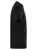 Moncler T -skjorte med falmet logo -motiv i bomull