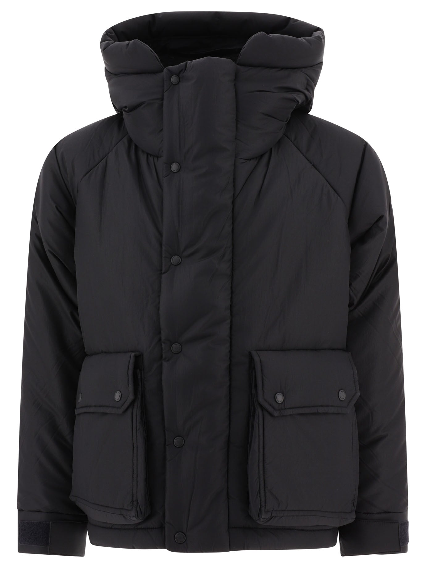 Quilted down jacket in black - And Wander